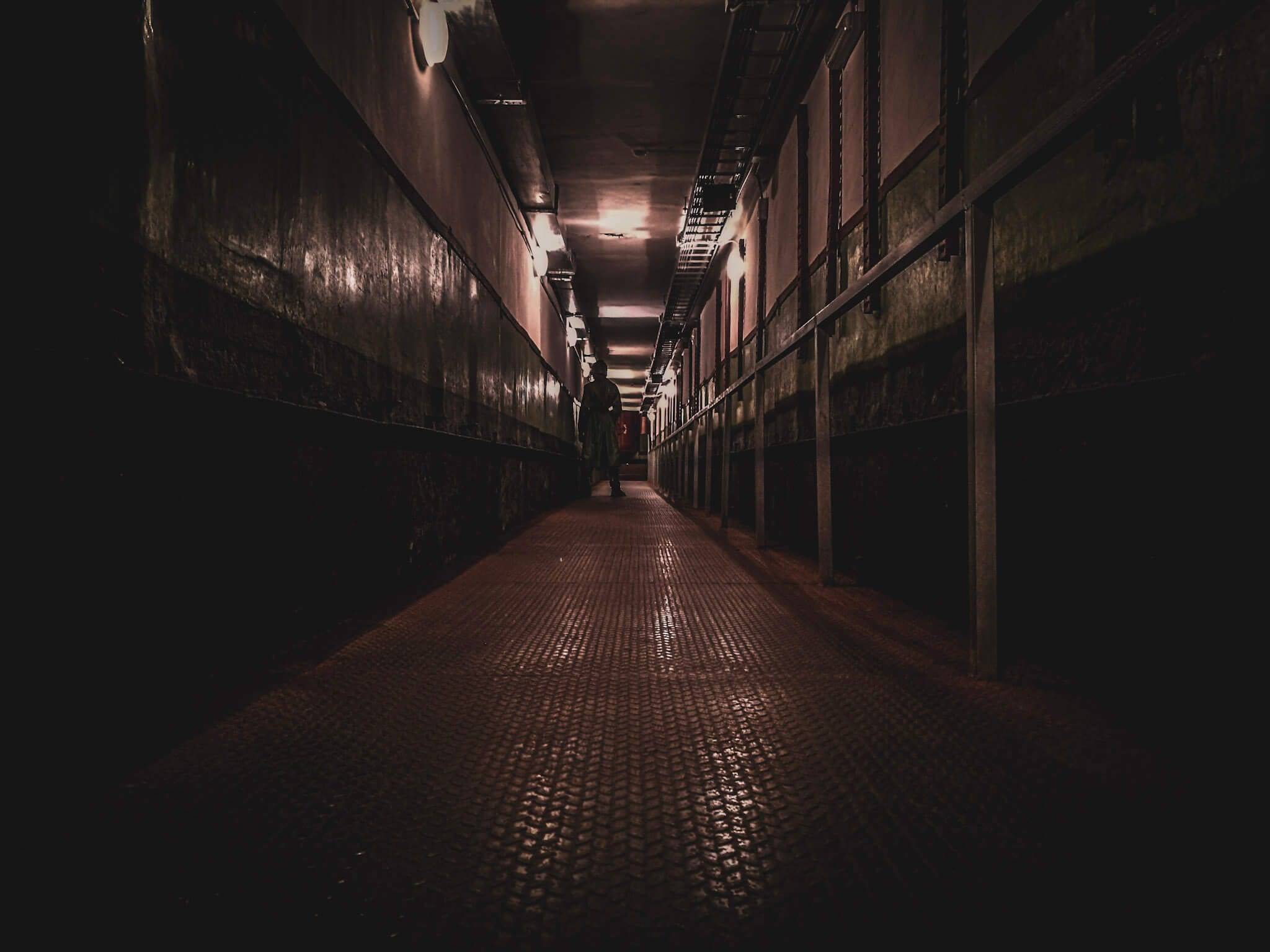 man standing in missile base corridor