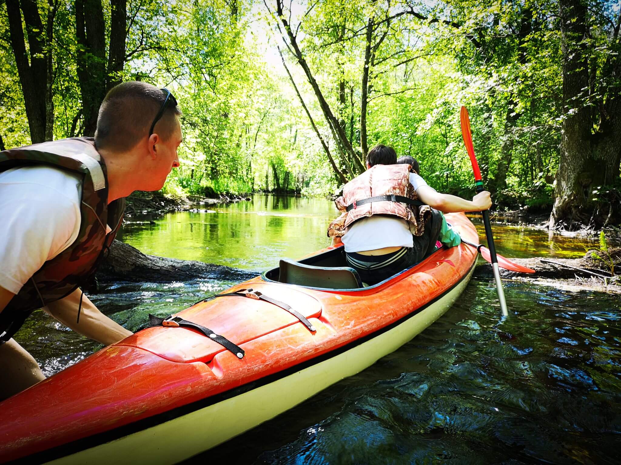 pushing a kayak in river buka