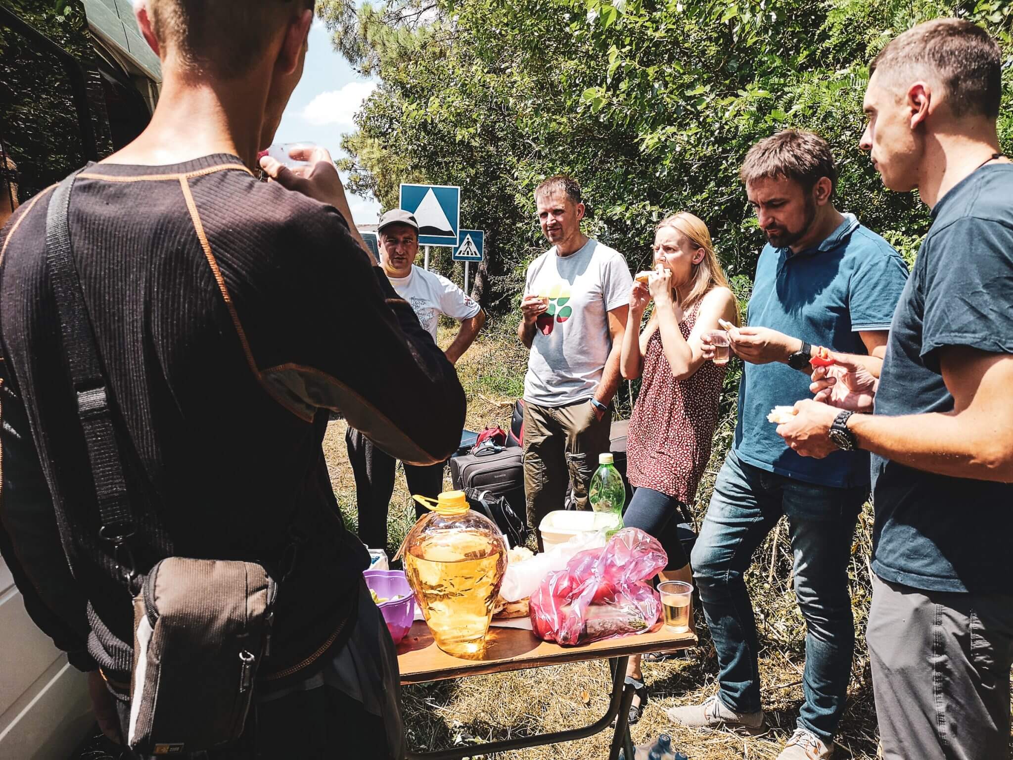 georgian driver meets visitors with food and wine