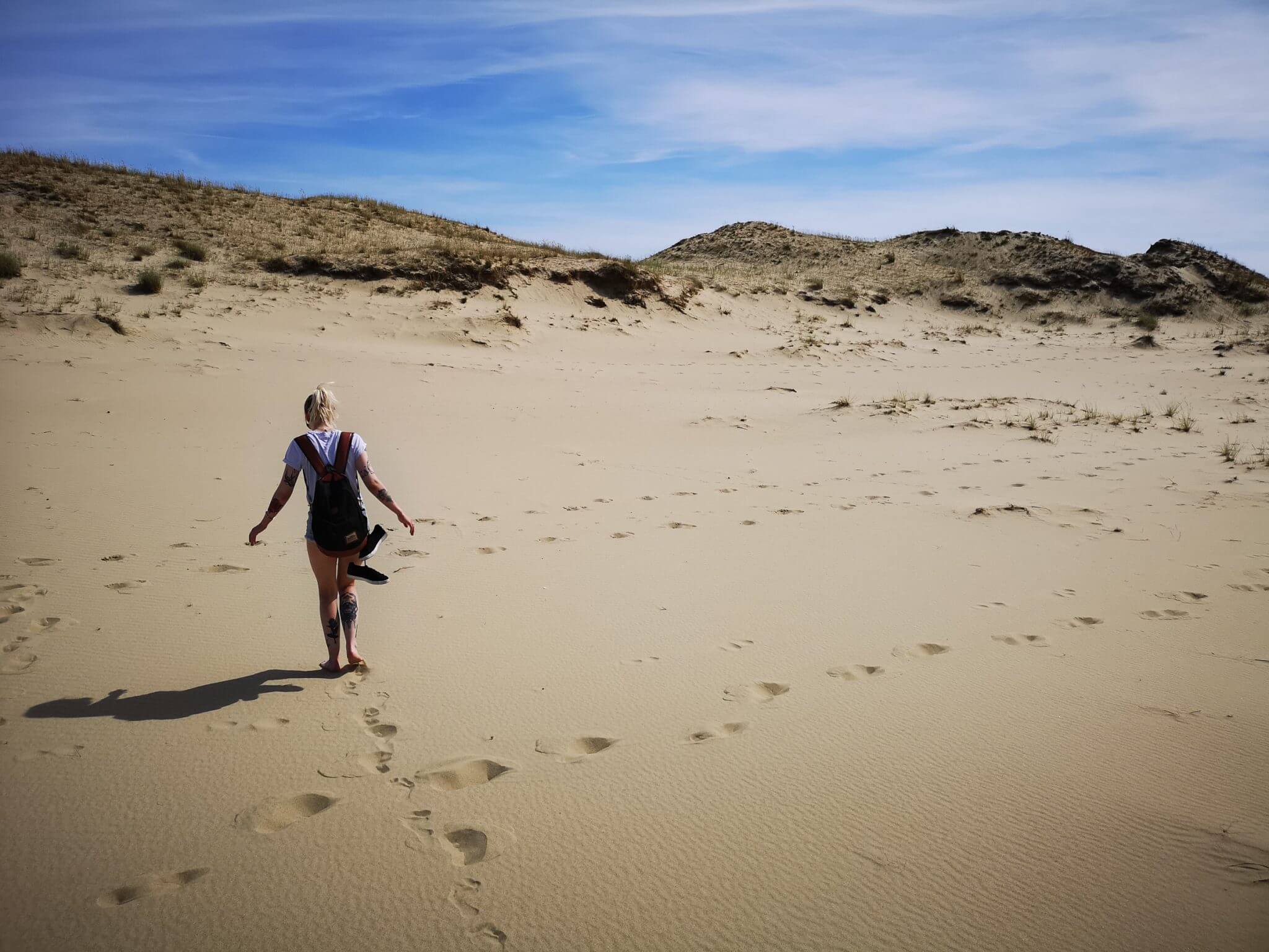 girl walking golden dunes nida