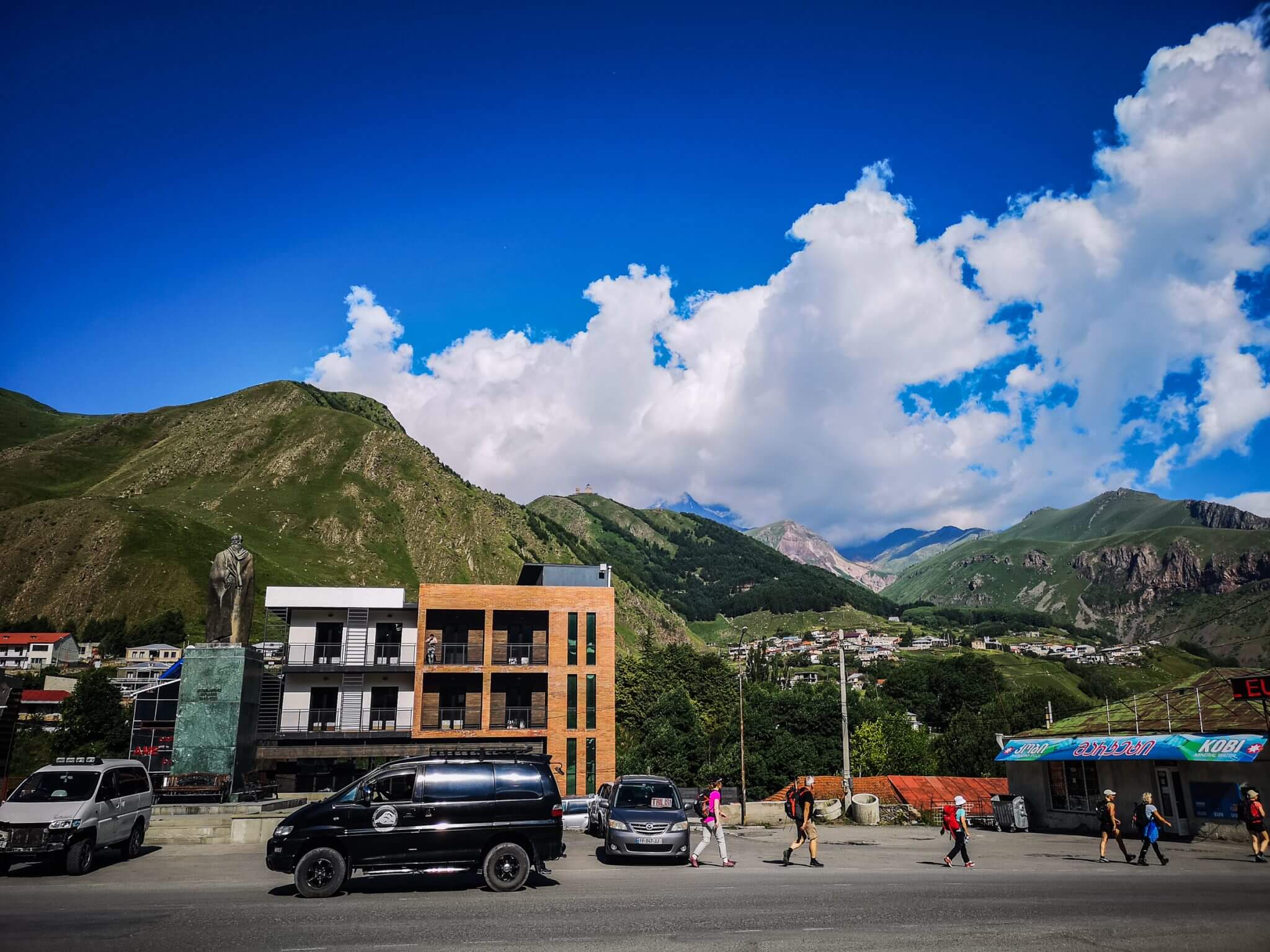 stepantsminda with caucasus mountains in background