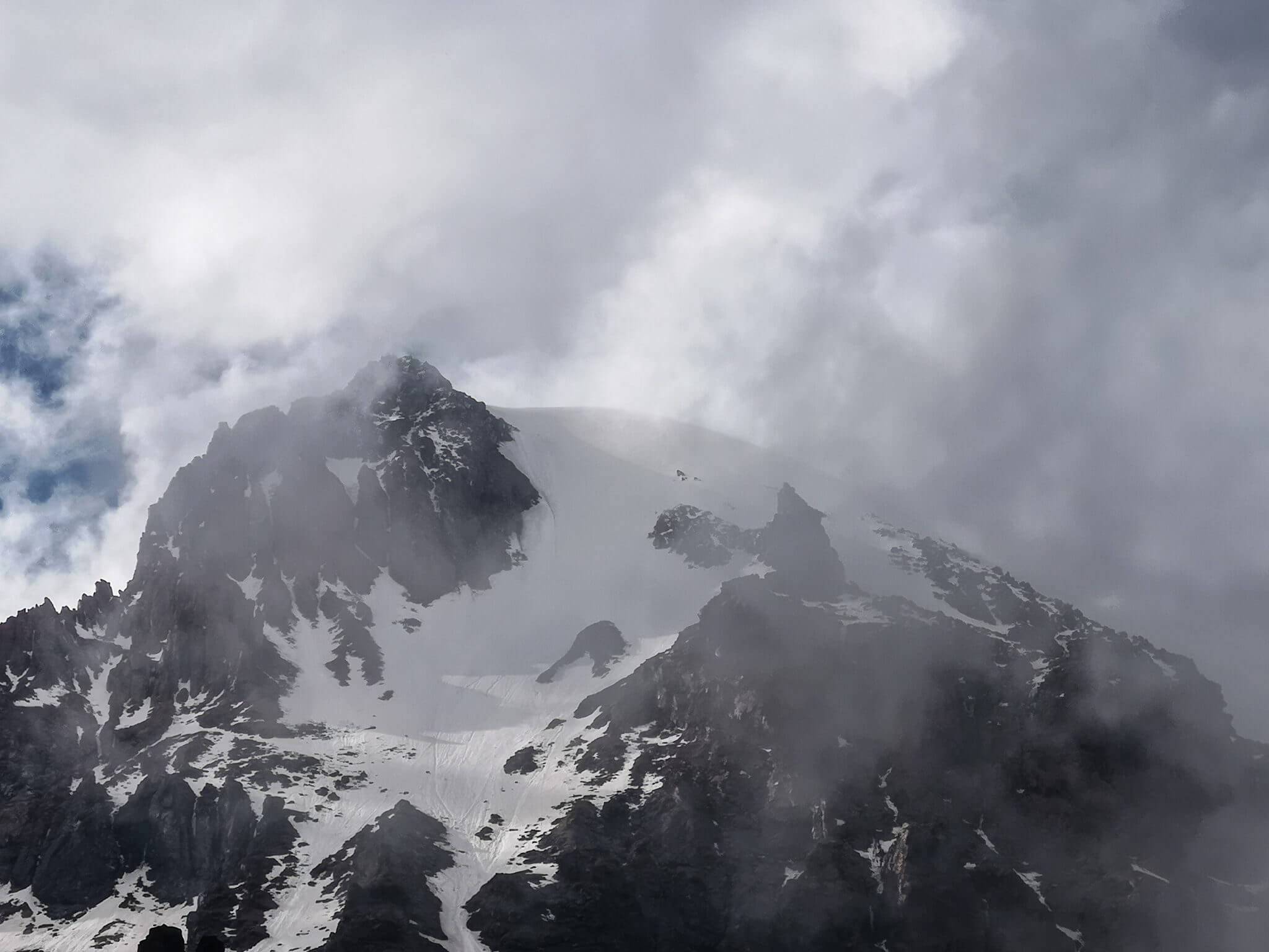 summit of mount kazbek covered by clouds