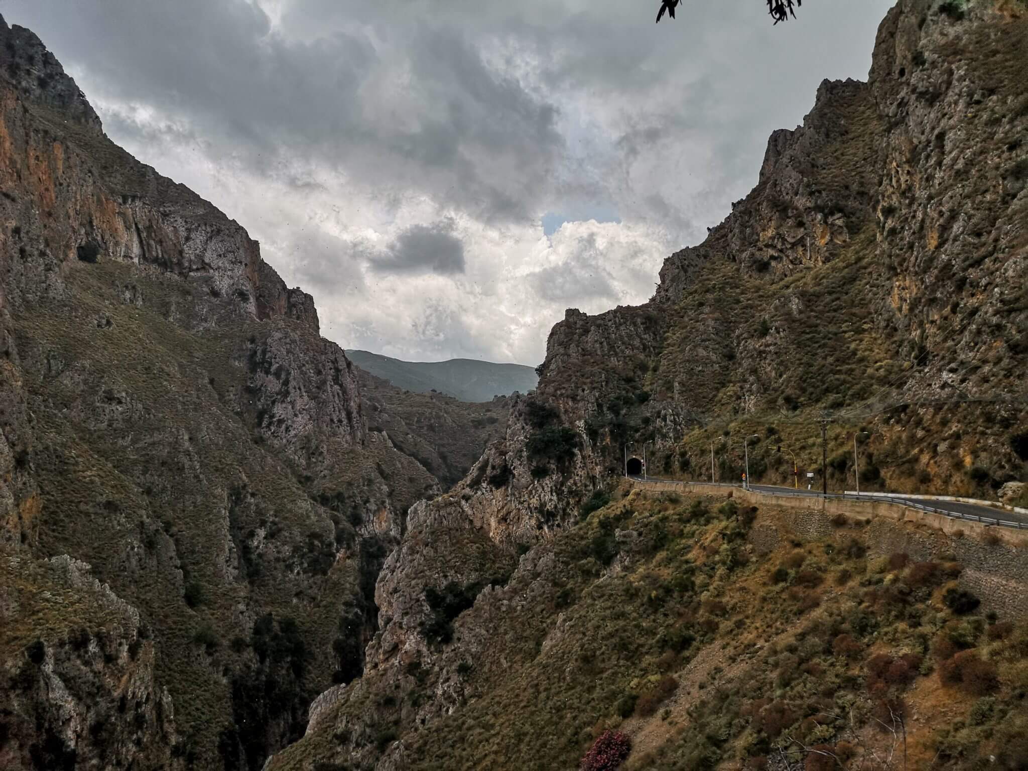 tunnel topolia gorge crete dramatic clouds