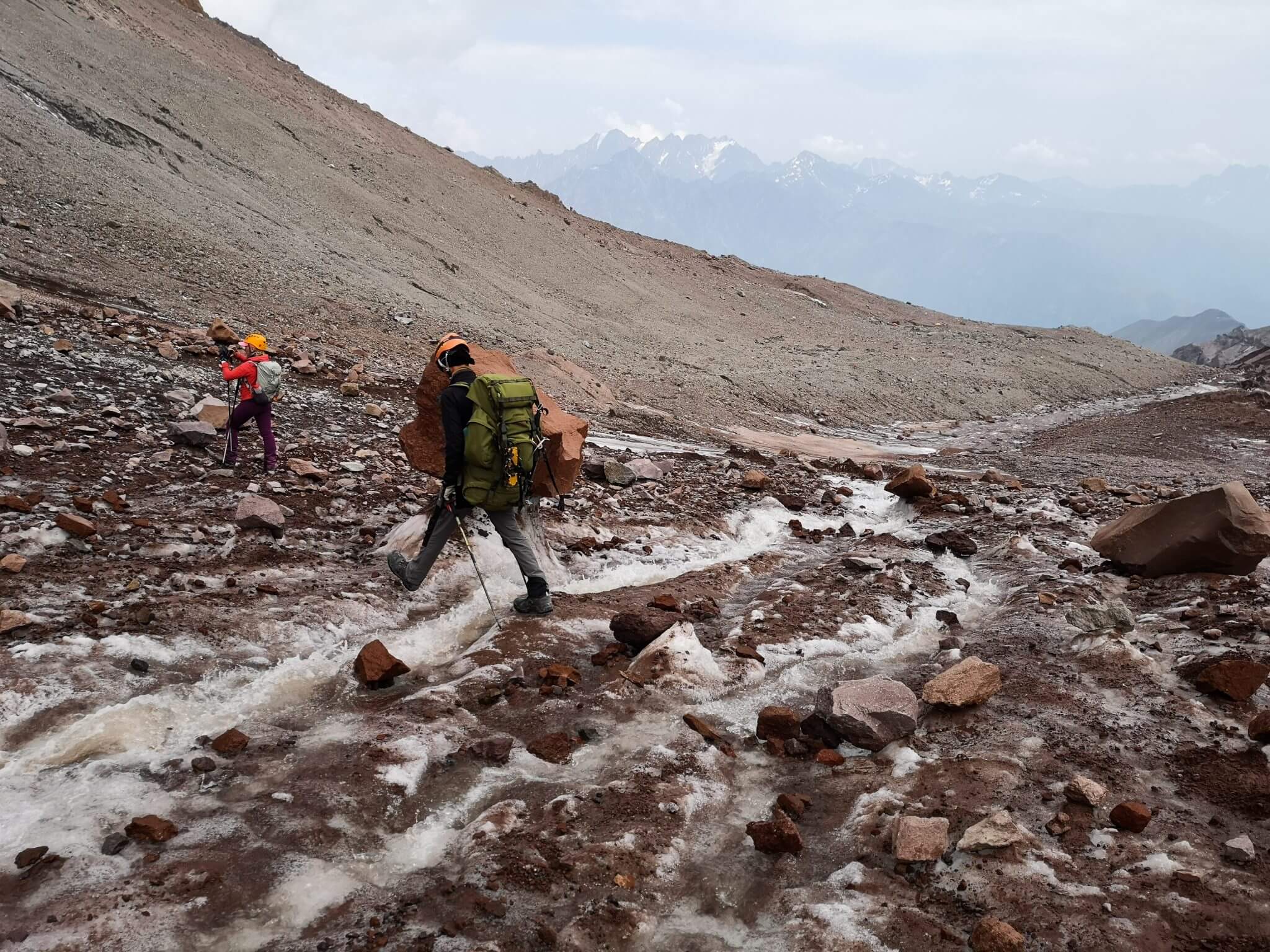 crossing a melt water mountain creek