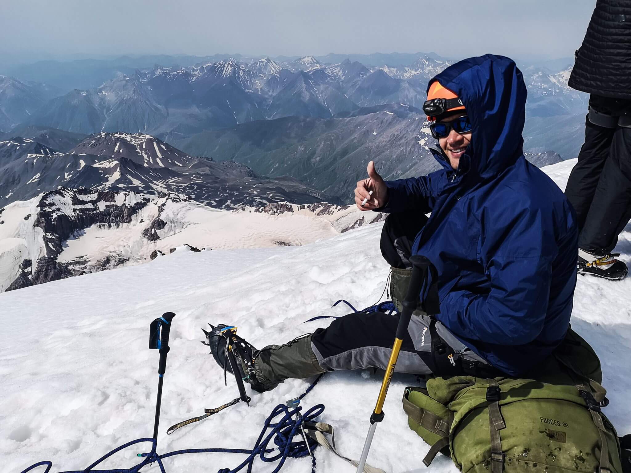 happy mountain climber on a peak