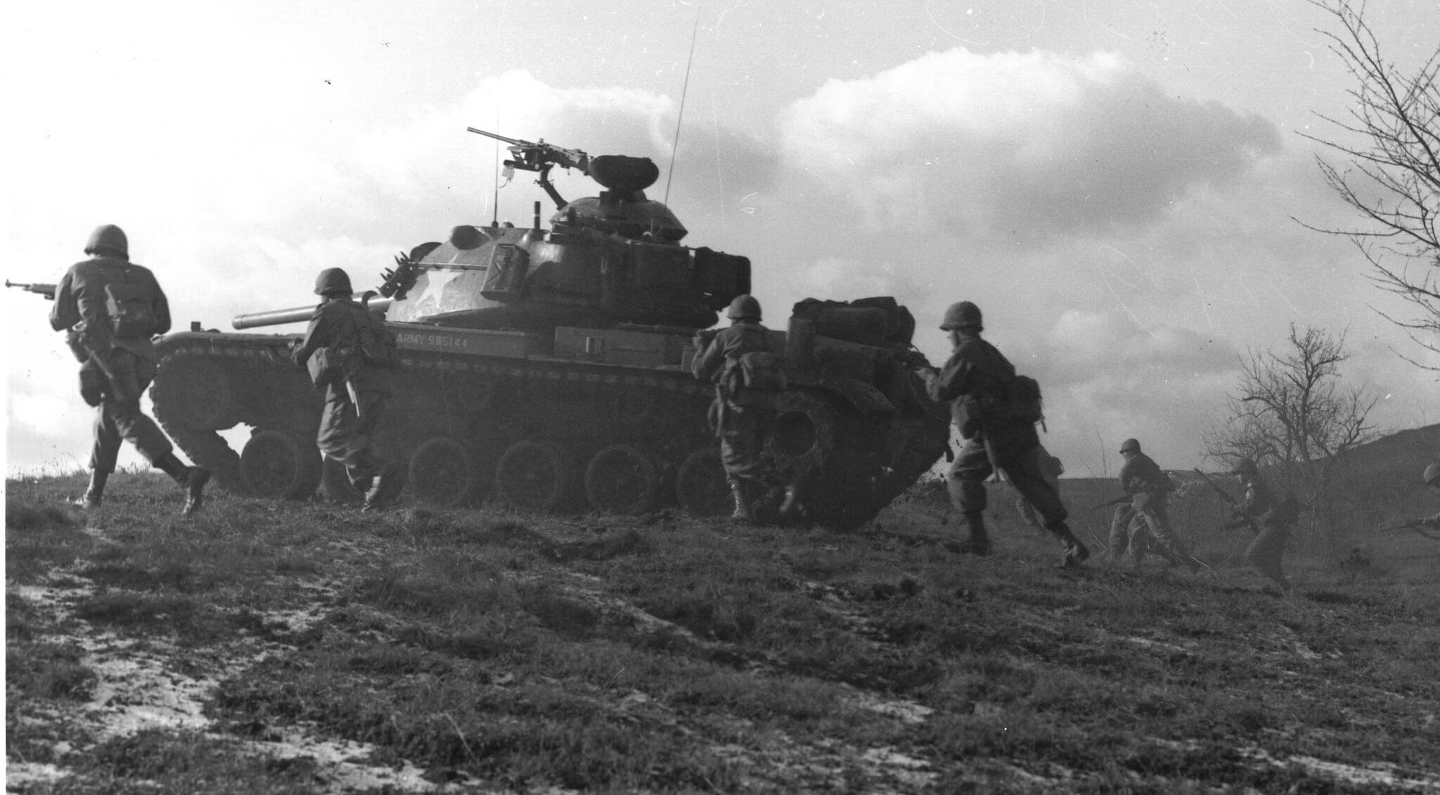 m60 tank with soldiers