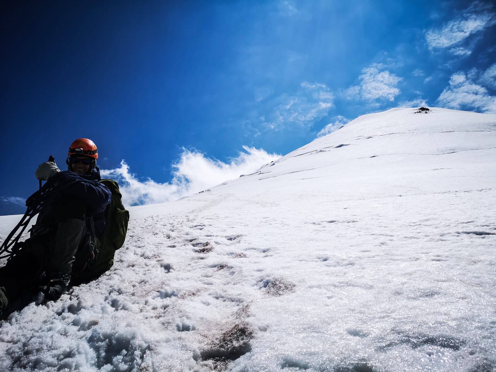 mountain climber sitting and resting