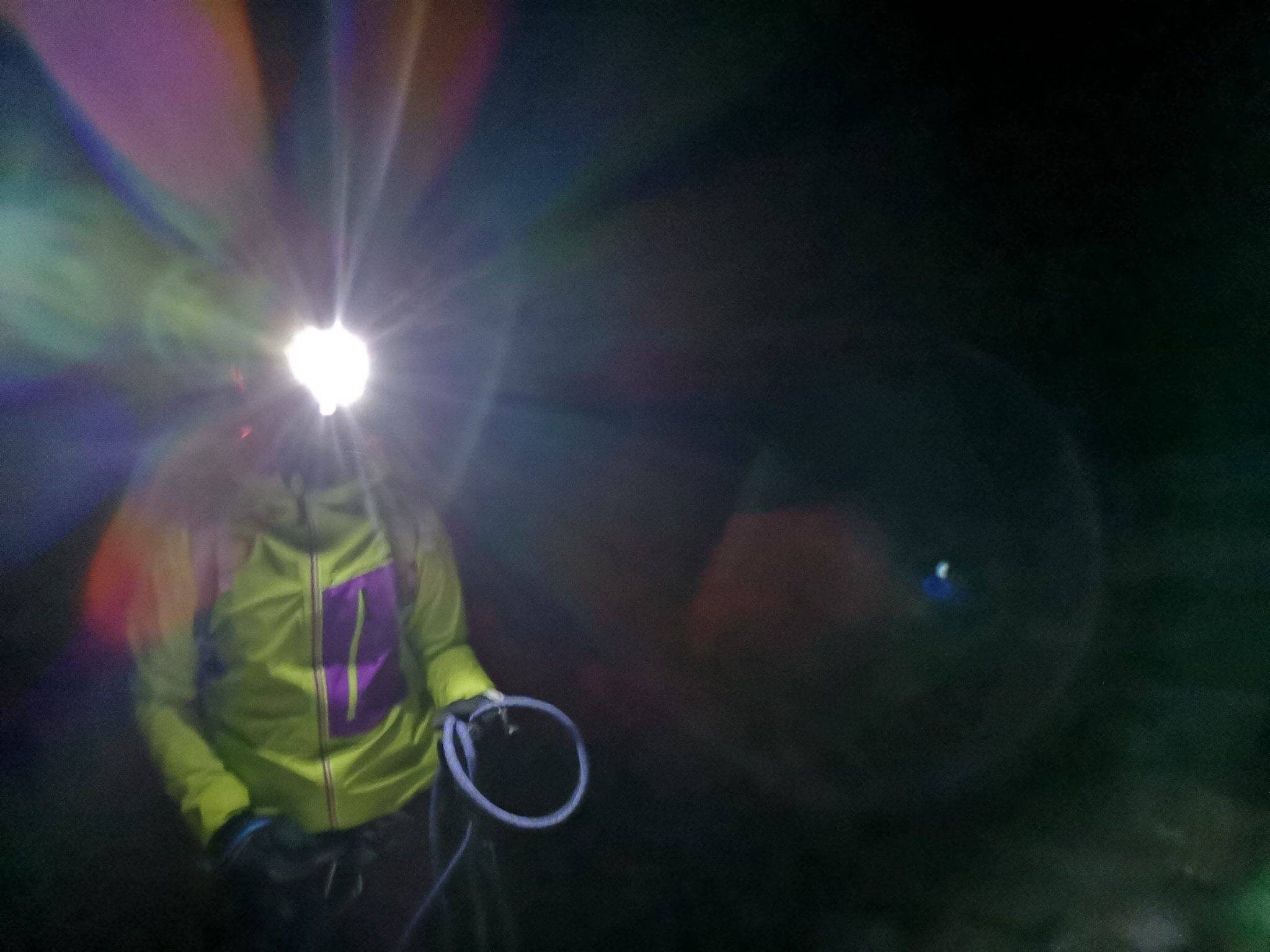 mountain climber with head flashlight