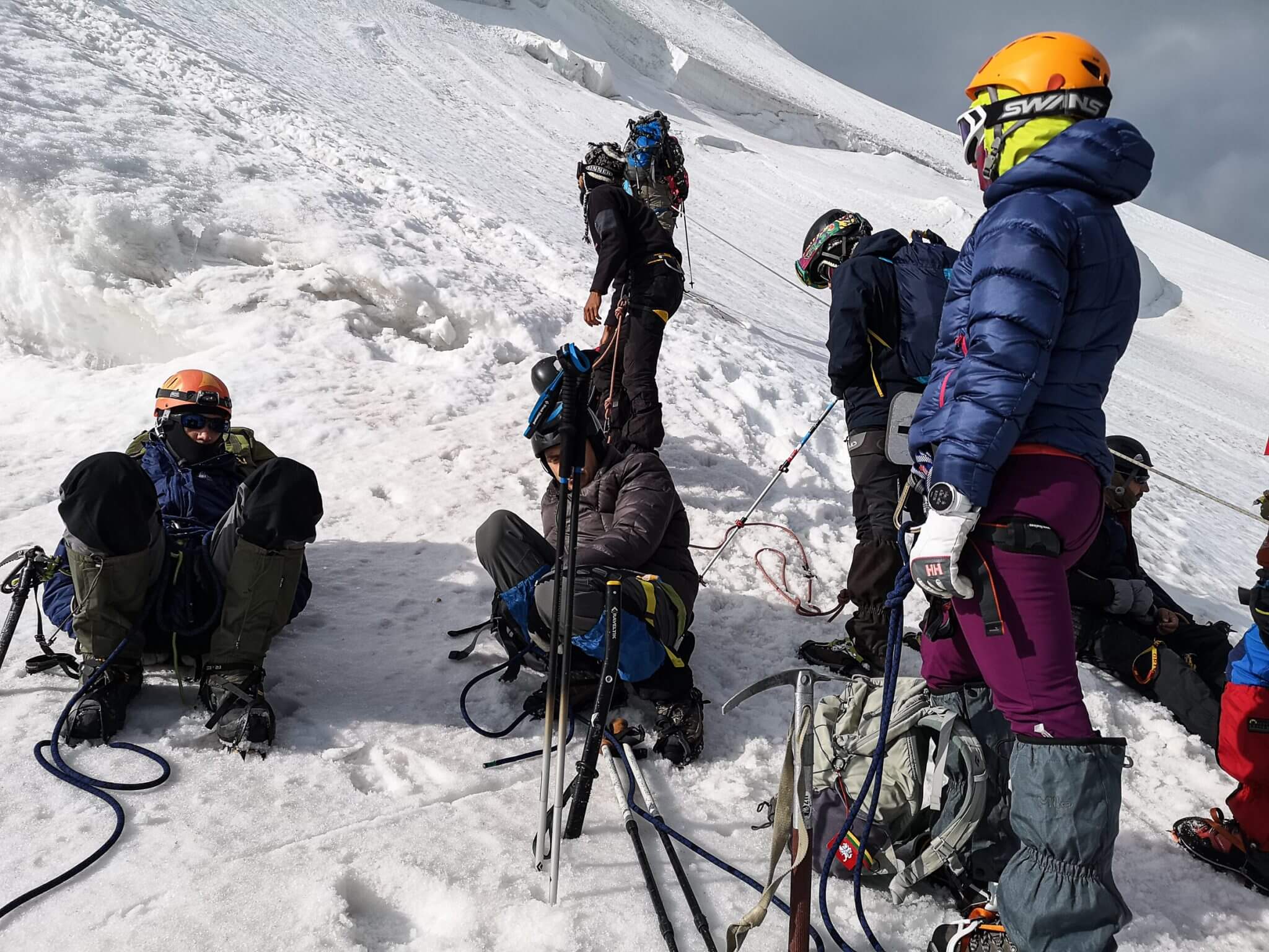mountain climbers resting high in the mountain