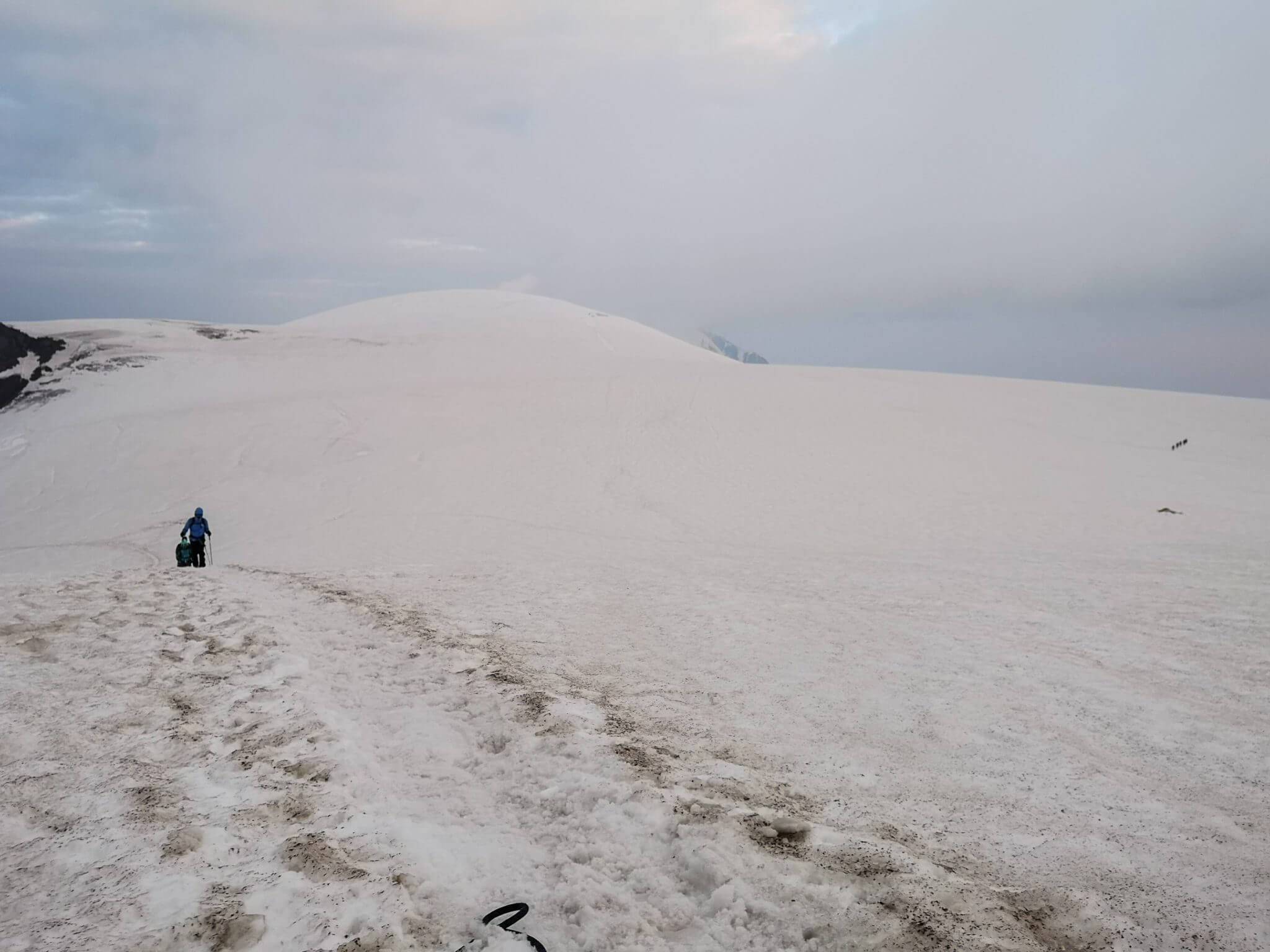 mountaineers climbing snowy mountain