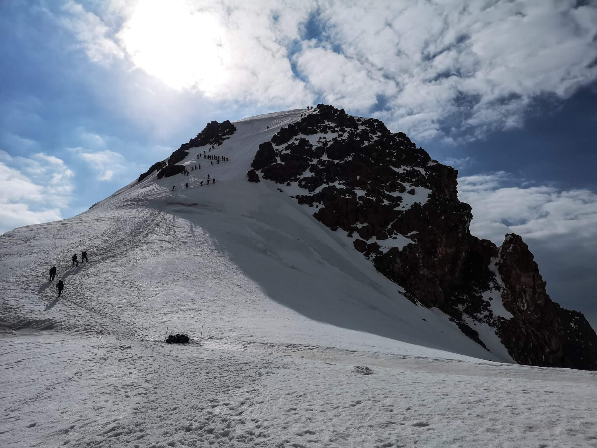 mountaineers climbing the peak of Mount Kazbek