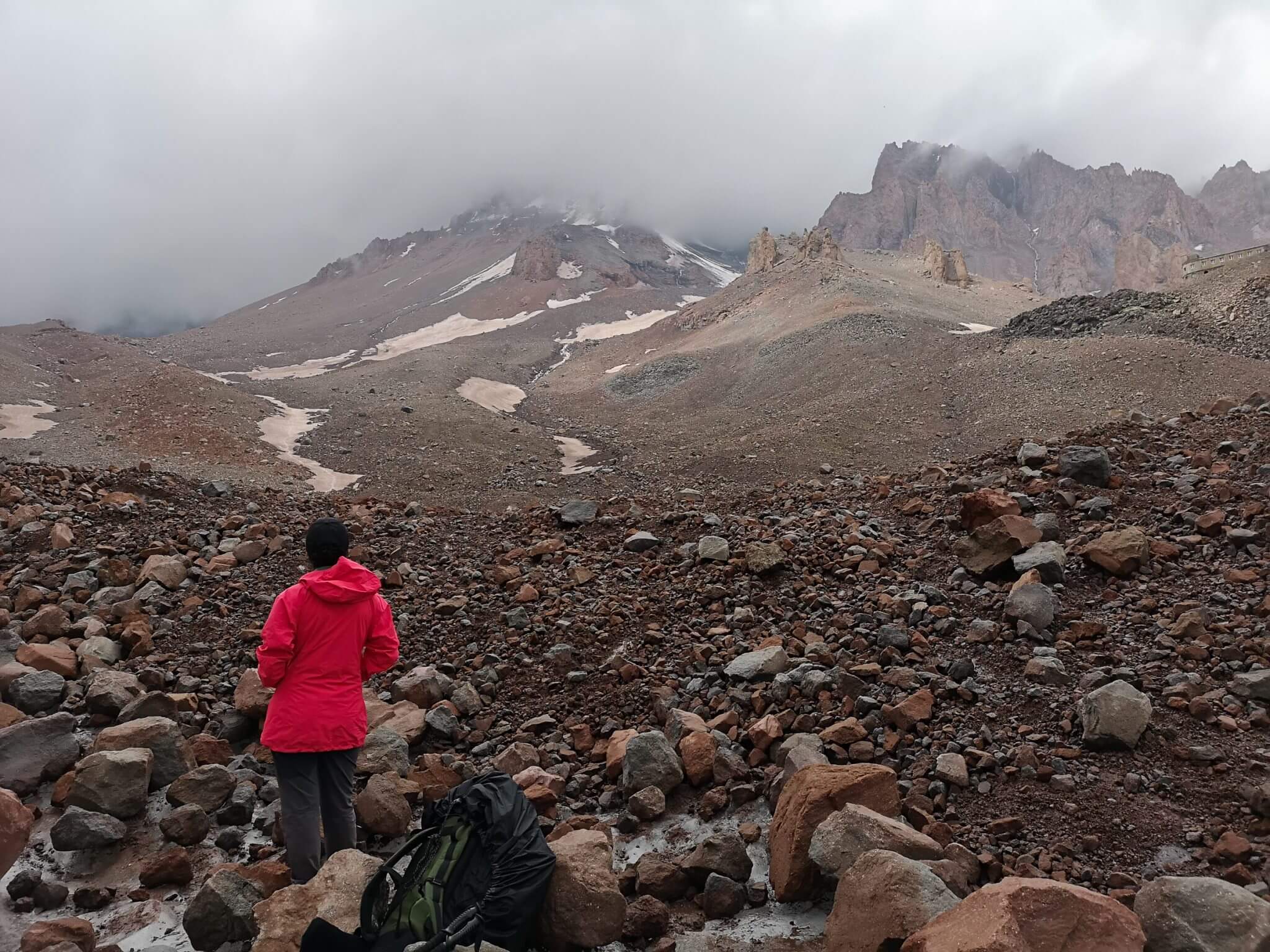 climber looking into mountain horizon