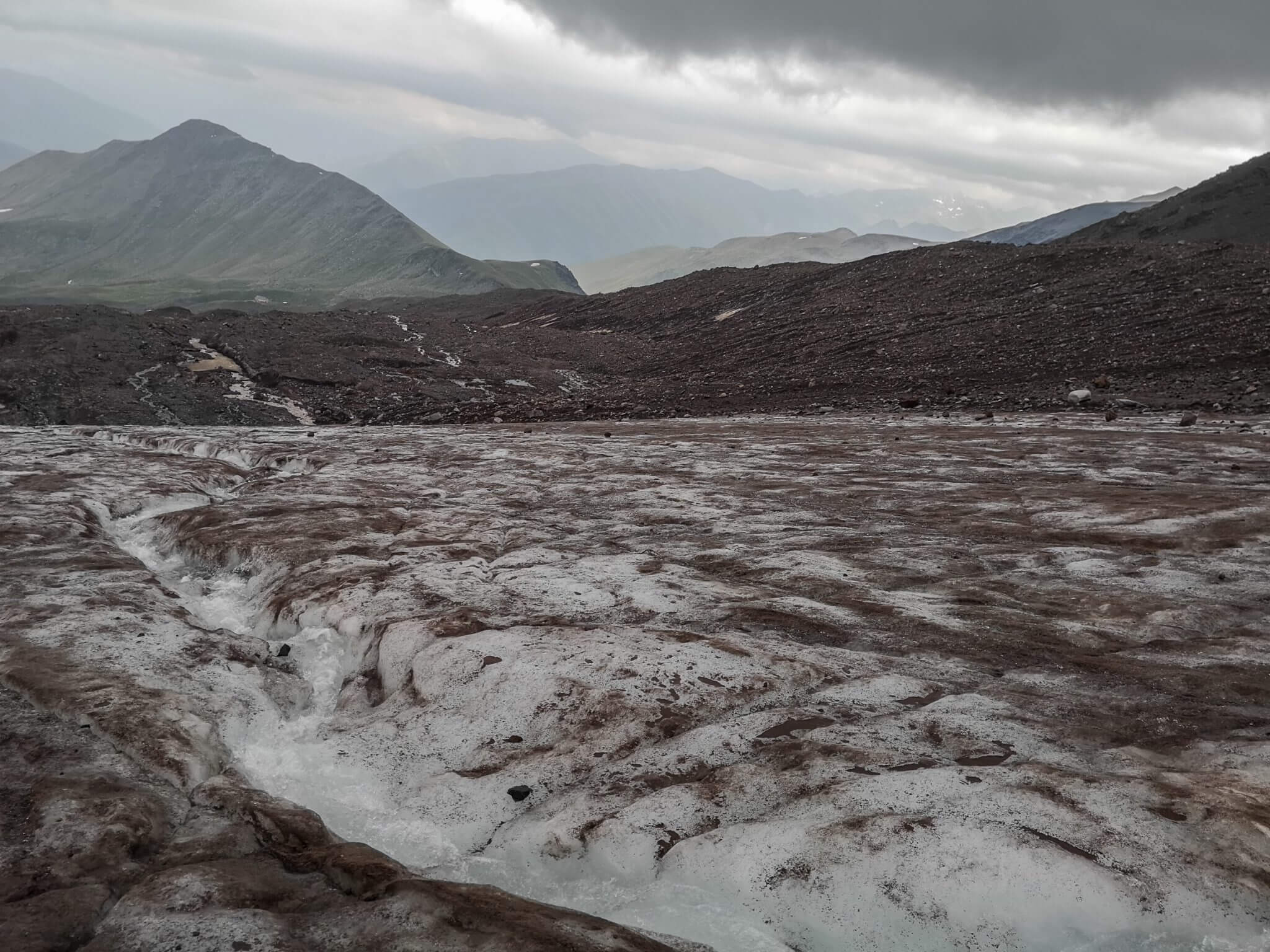 melt water stream down glacier mountains
