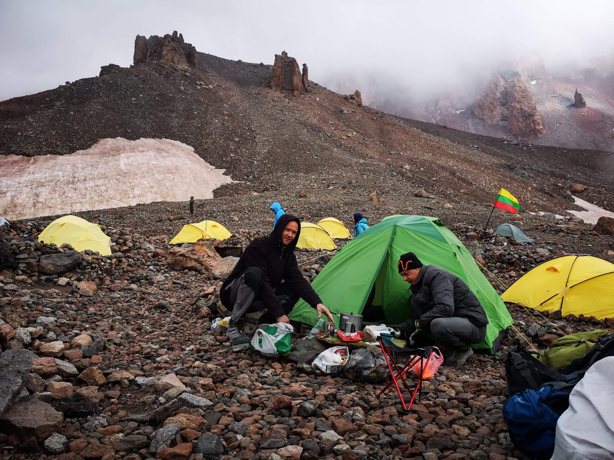 two climbers near tent