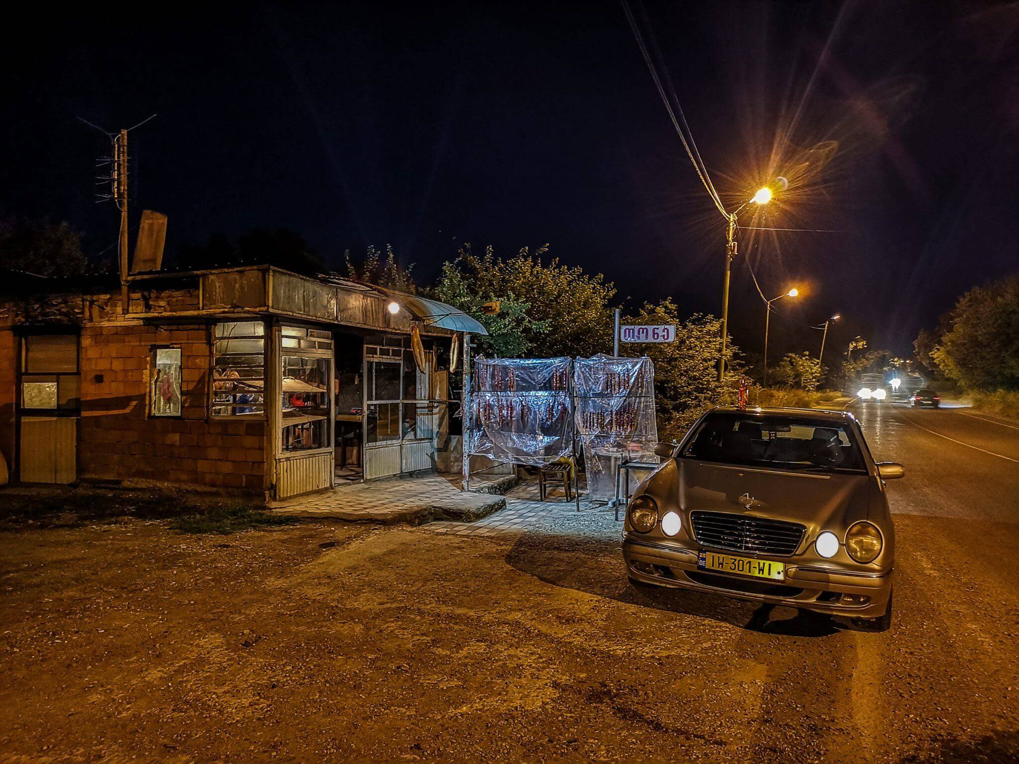 car near small shop near road georgia