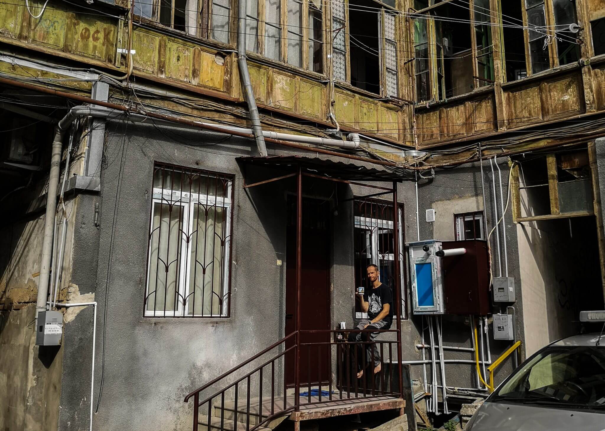drinking coffee in tbilisi apartament inner yard