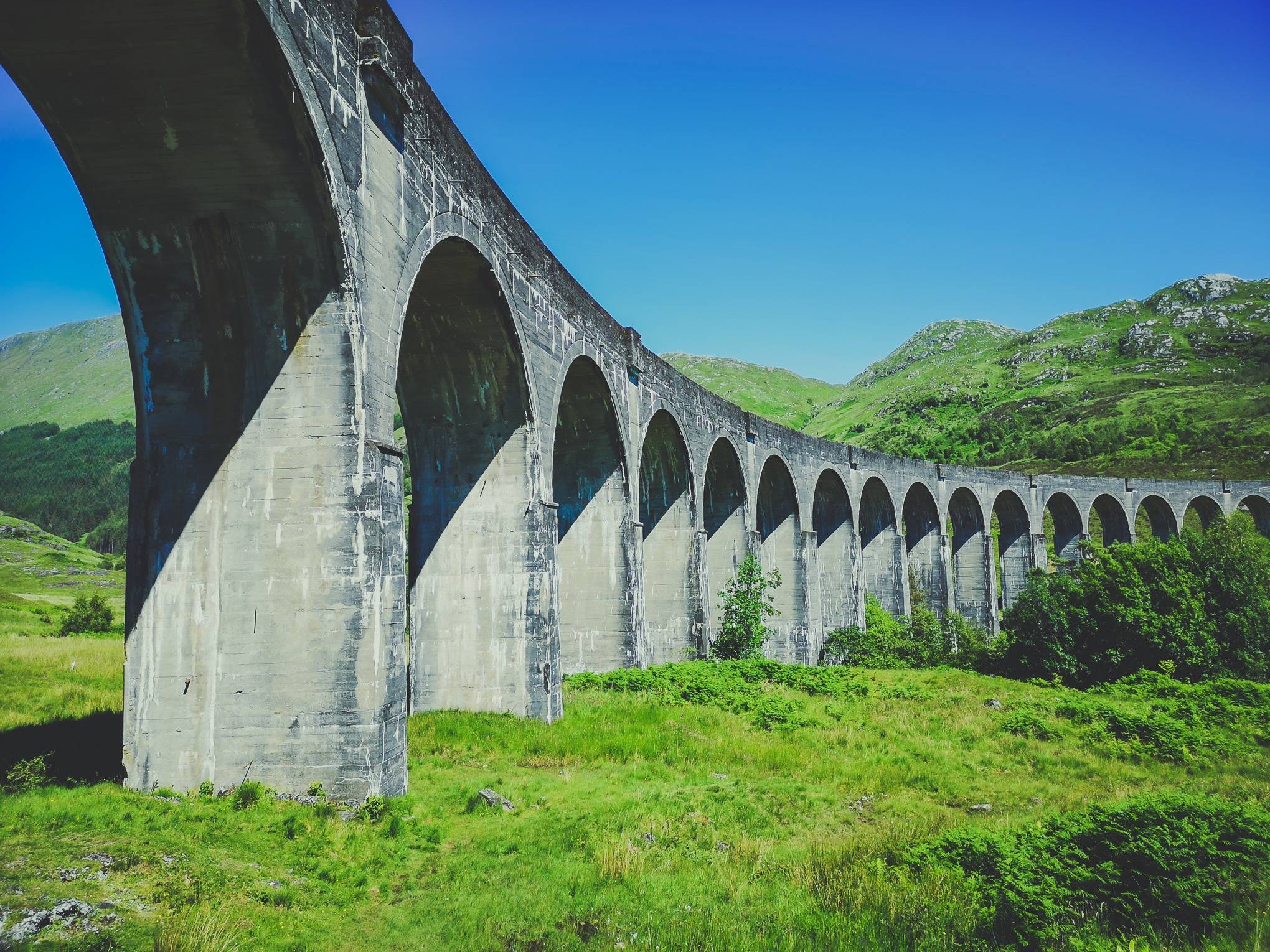   Glenfinnan Viaduct from below on a sunny summer day, Scotland. Photo by Alis Monte [CC BY-SA 4.0], via Connecting the Dots