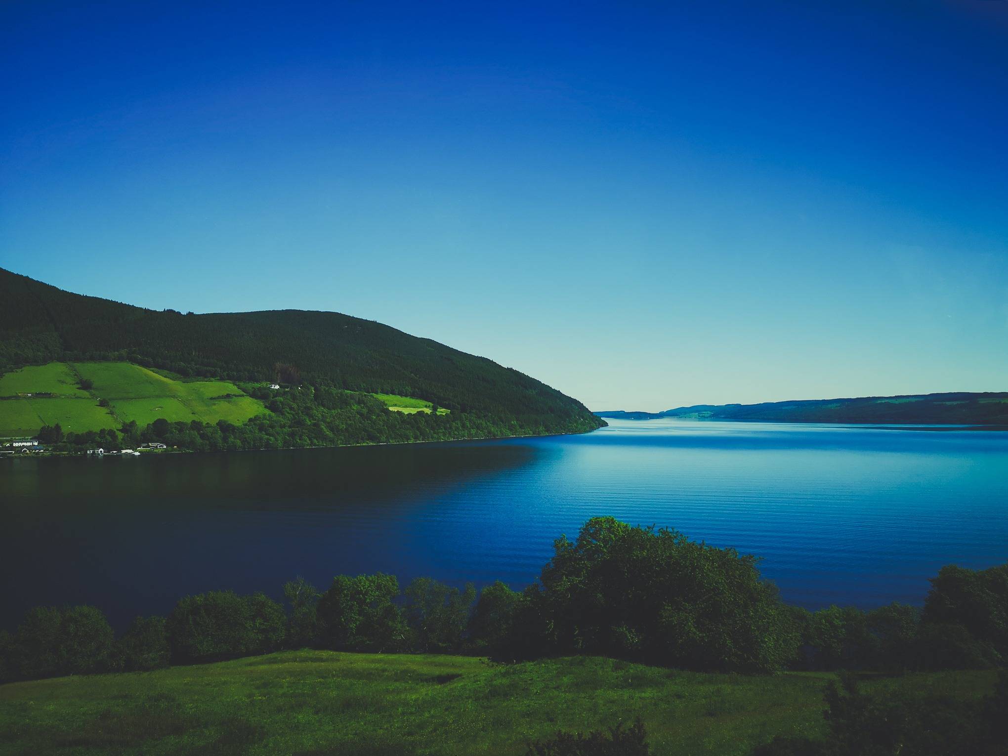   Loch Ness surounded by hills on a sunny day, Highlands of Scotland. Photo by Alis Monte [CC BY-SA 4.0], via Connecting the Dots