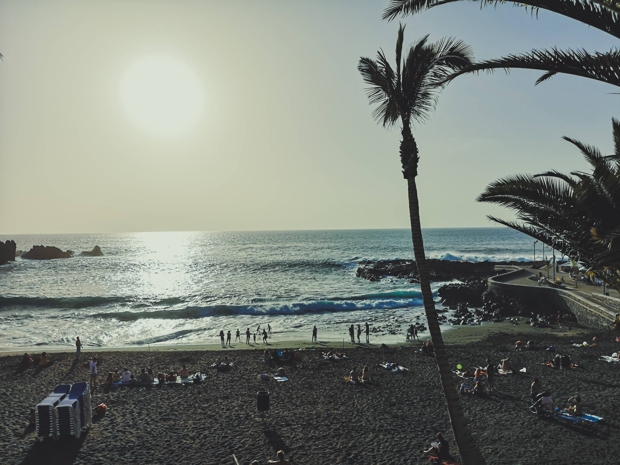   Most of the beaches in Tenerife has its sand colored black by Teide volcano. Photo by Alis Monte [CC BY-SA 4.0], via Connecting the Dots
