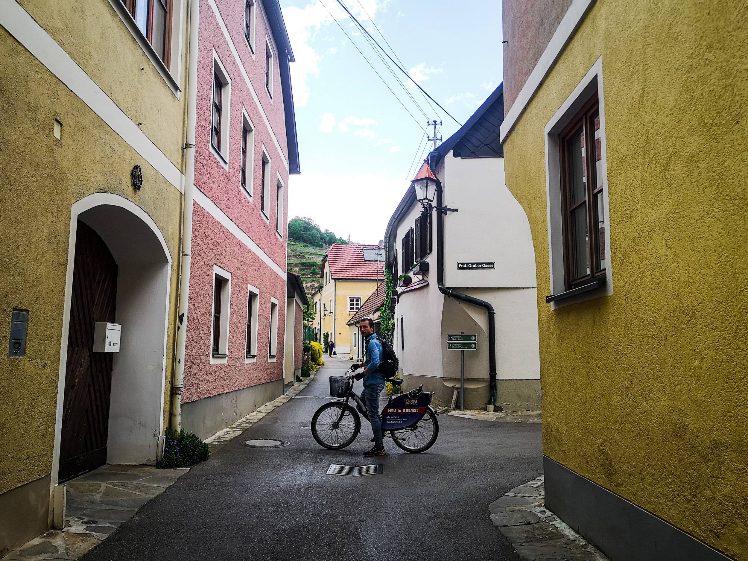 Riding a bike in the narrow streets of Wösendorf in der Wachau, Austria