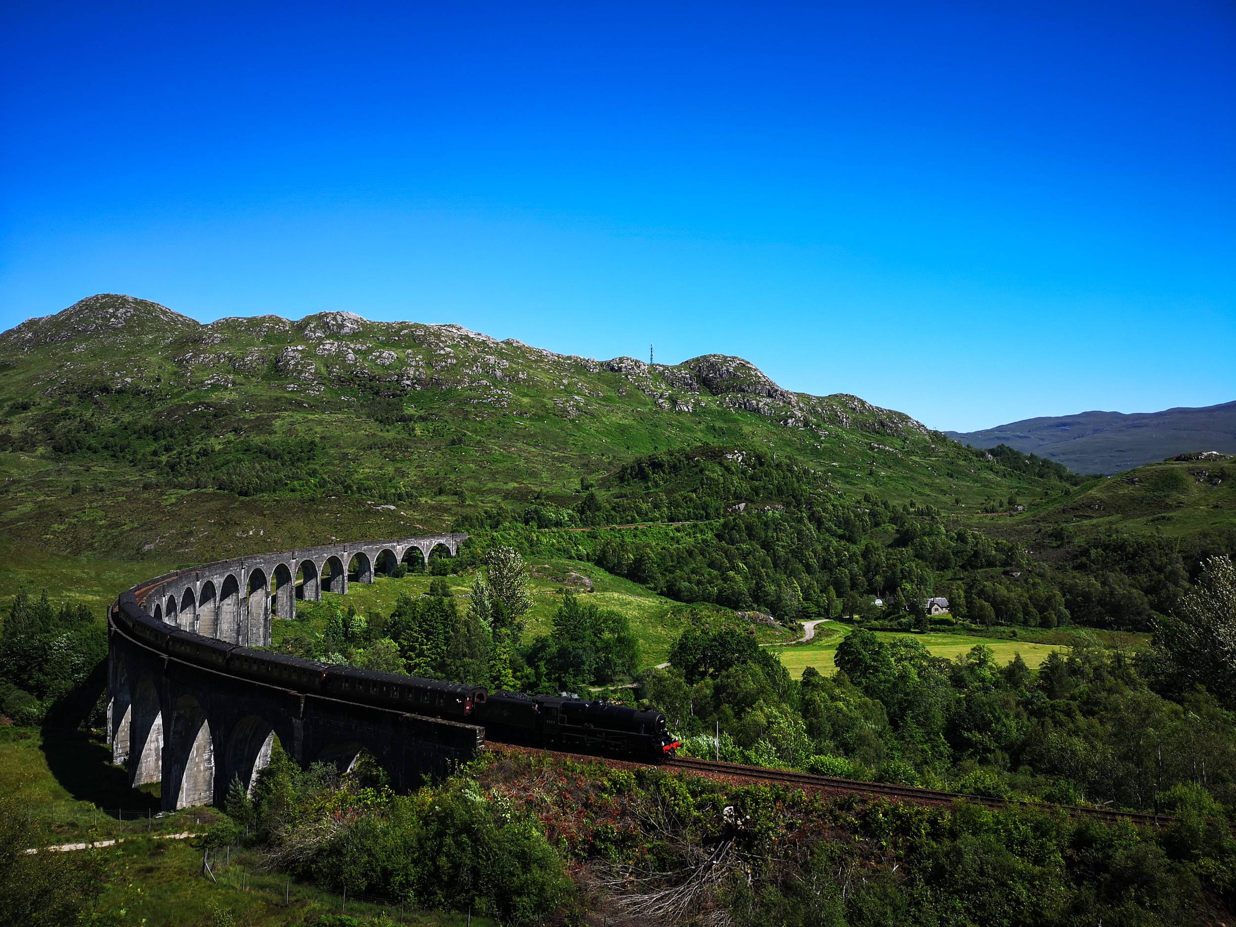 Harry Potter Train "The Jacobite" passing Glenfinnan Viaduct, Scotland