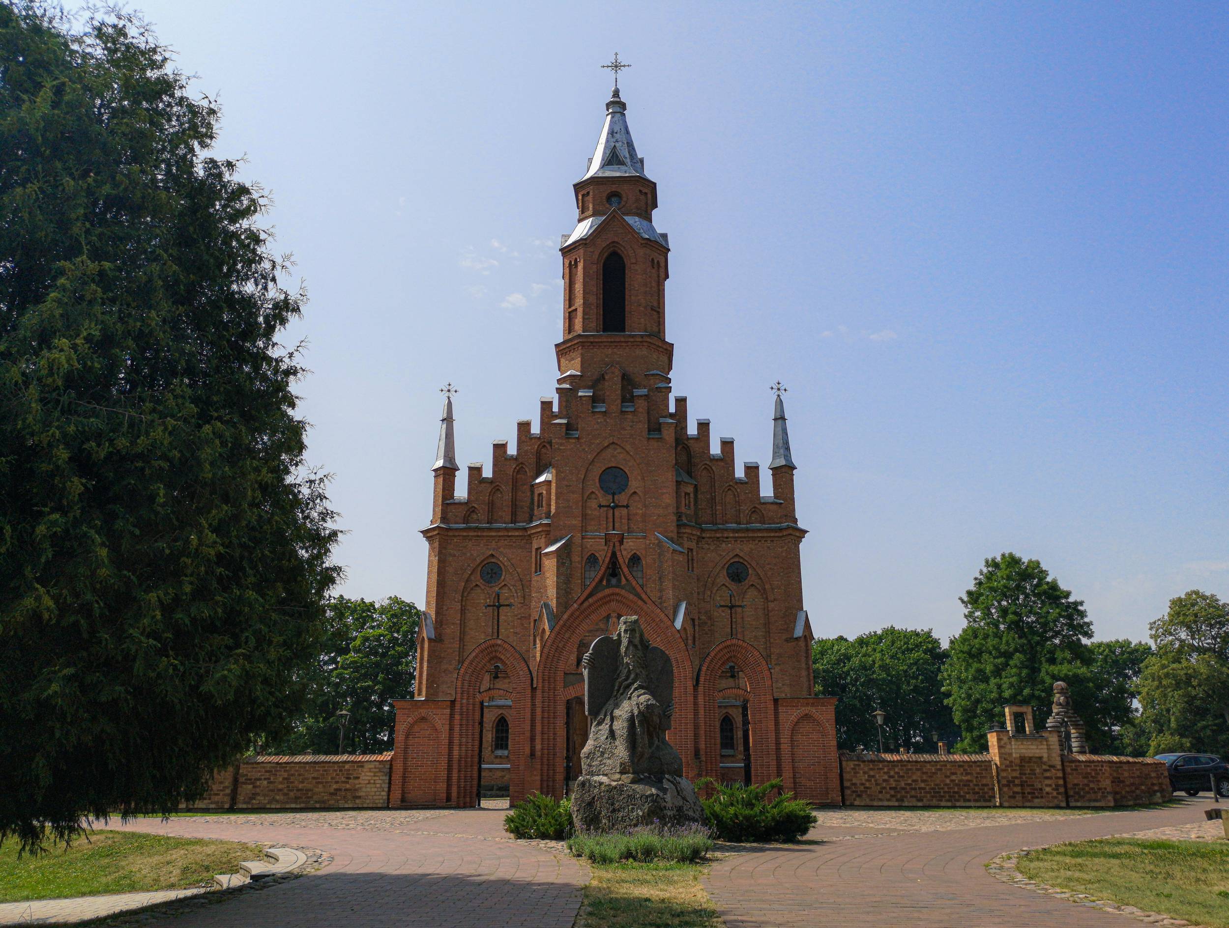 Moses Statue and Kernavė Holy Lady Maria Church