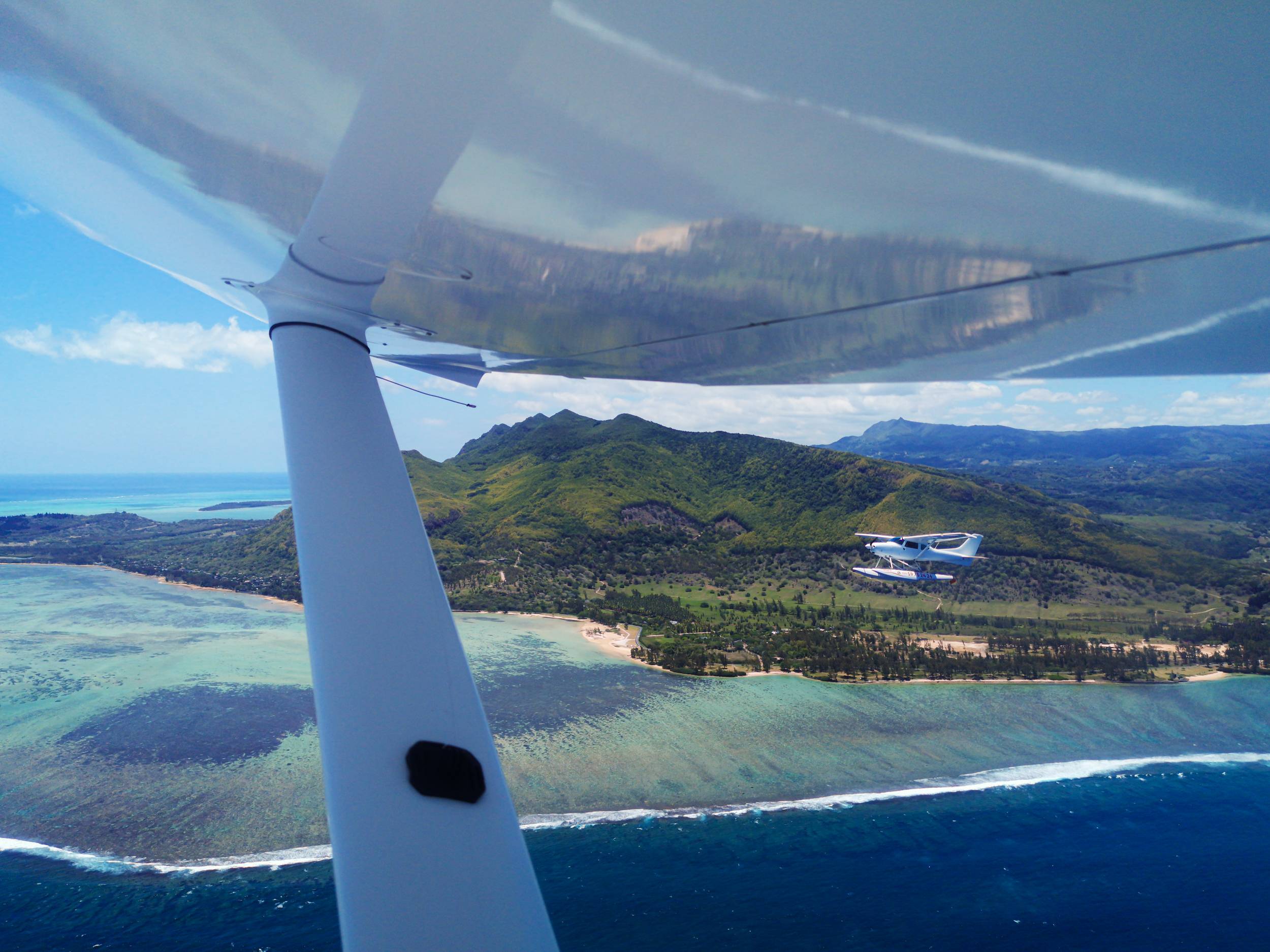 A synced seaplane flight over Mauritius underwater waterfall