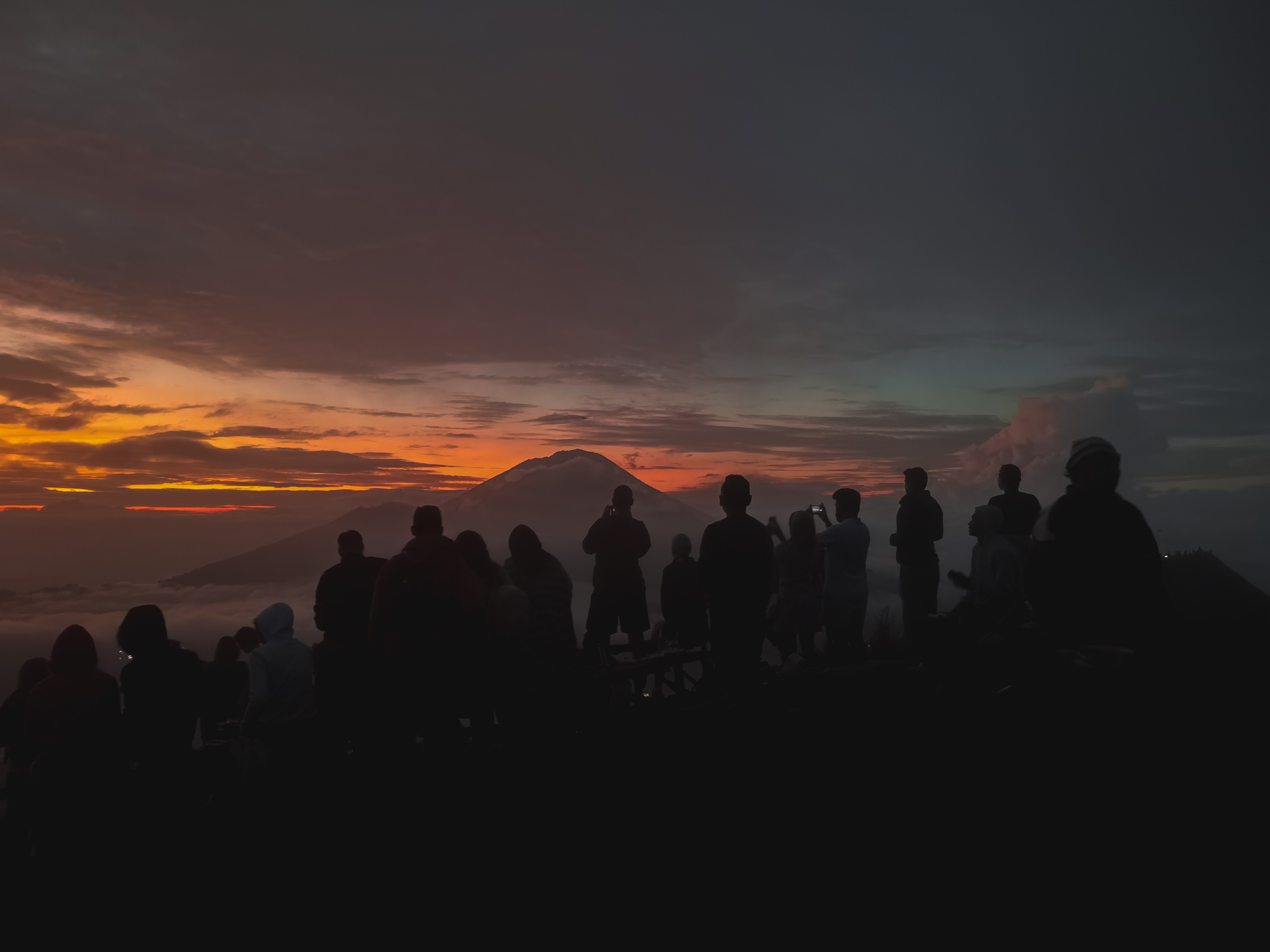 People watching sunrise on Mount Batur, Bali